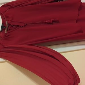 White House Black Market dark red top Size 4. Long bell sleeves and tassel tie